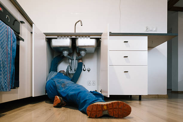 Professional Drain Cleaning technician working in Raymond, WA